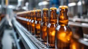 Image of glass bottles on a conveyor line